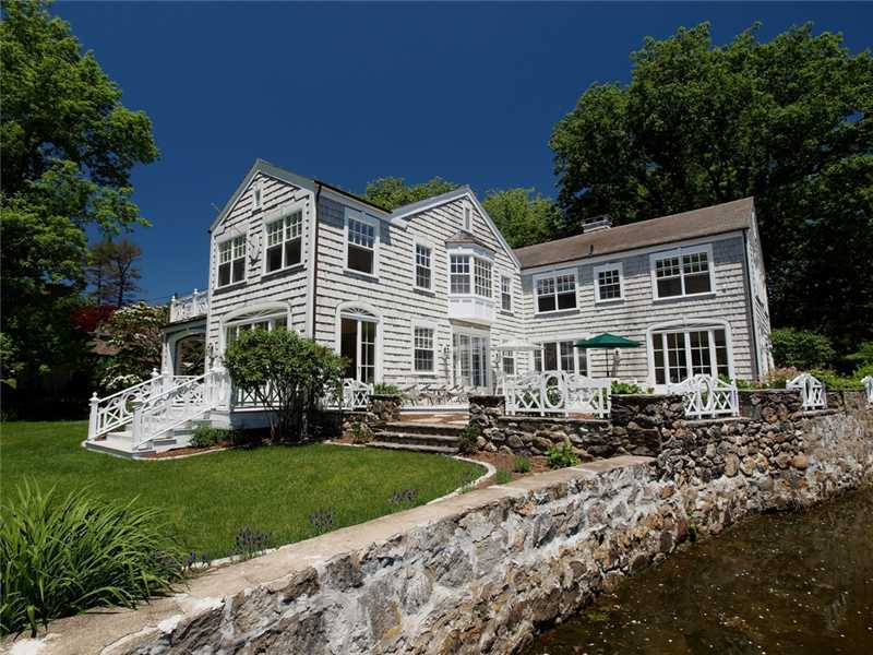 3 Coves End Road Darien, CT 06820 - Photo 20 of 22 a front view of a house with a yard
