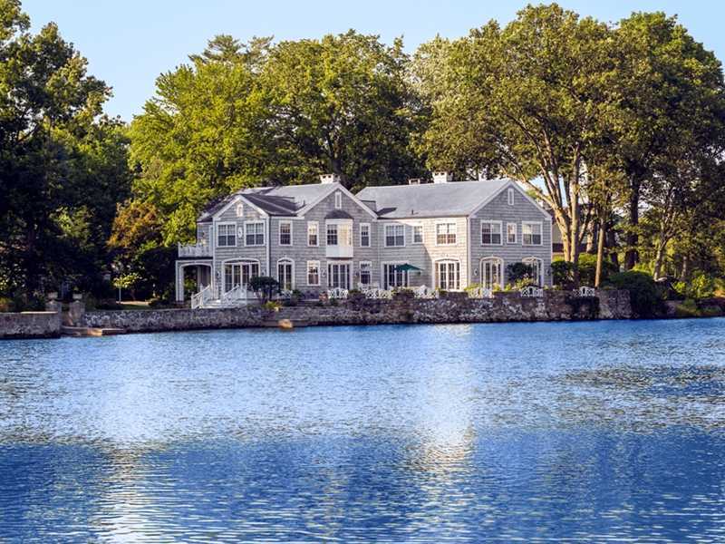 3 Coves End Road Darien, CT 06820 - Photo 22 of 22 a front view of a house with a yard and large trees