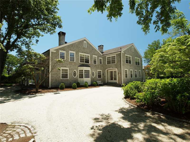 3 Coves End Road Darien, CT 06820 - Photo 4 of 22 a front view of a house with a yard covered with snow