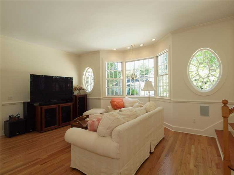 3 Coves End Road Darien, CT 06820 - Photo 10 of 22 a living room with furniture a large window and a flat screen tv