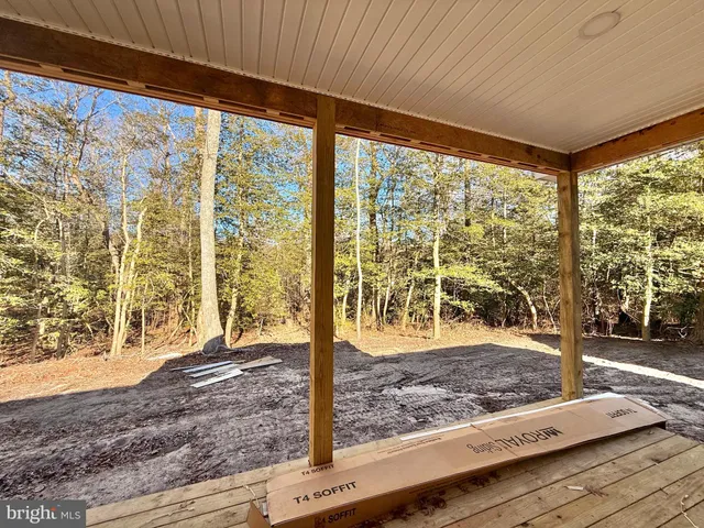 a view of a room and wooden floor
