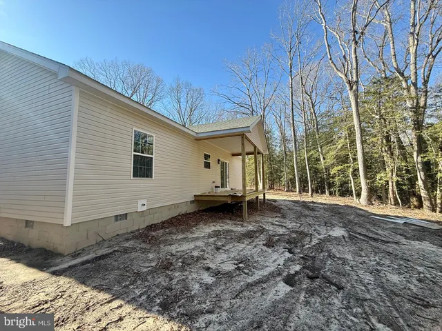 a view of a backyard with a house