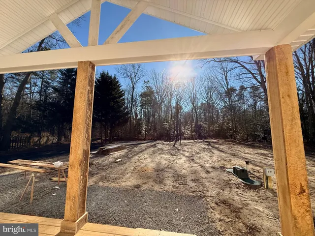a view of a backyard with tree s