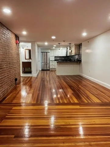 a view of kitchen and dining room with wooden floor