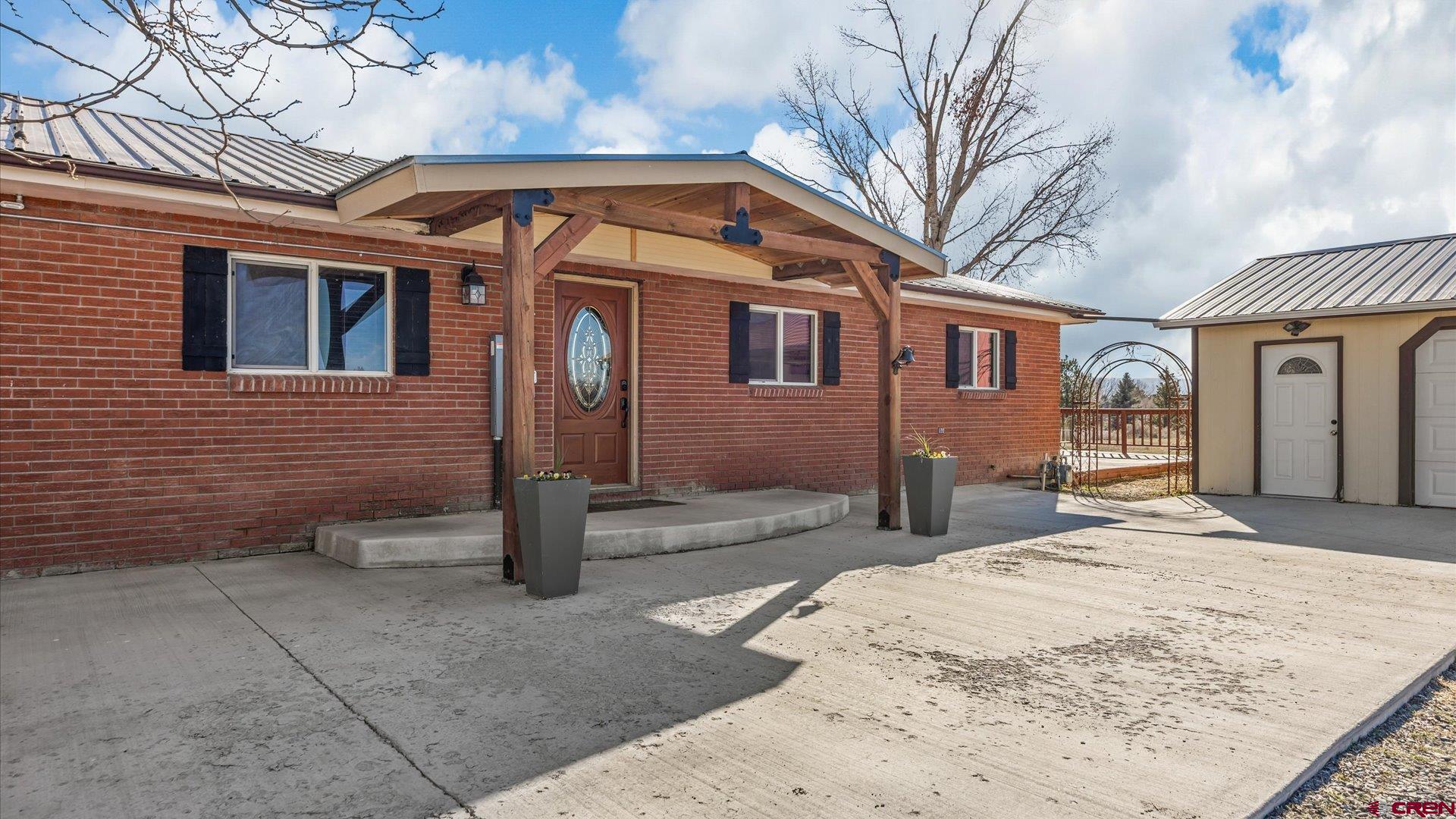 16205 6700th Road Montrose, CO 81401 - Photo 15 of 34 a front view of a house with parking