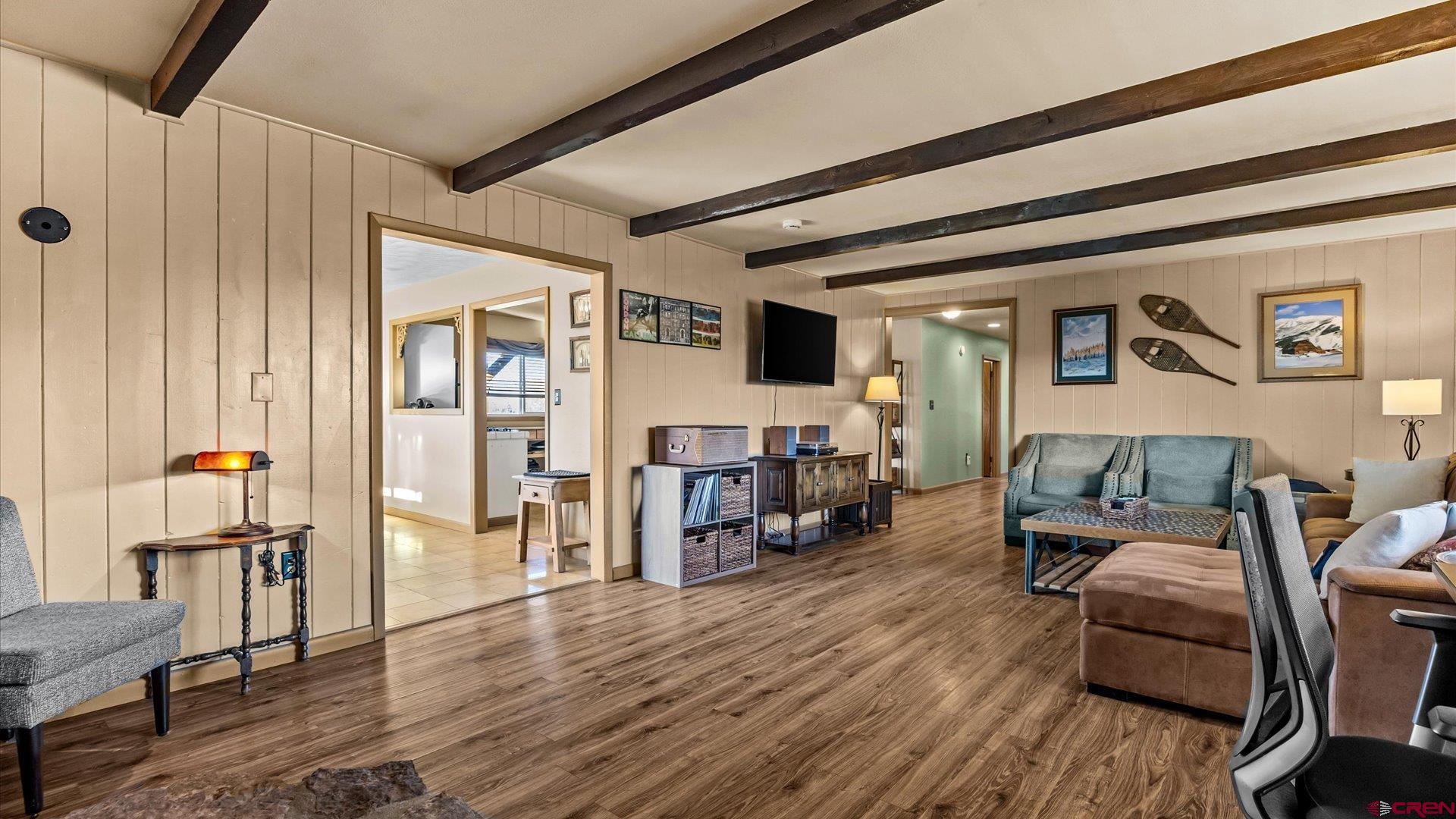 16205 6700th Road Montrose, CO 81401 - Photo 31 of 34 a living room with furniture and a wooden floor