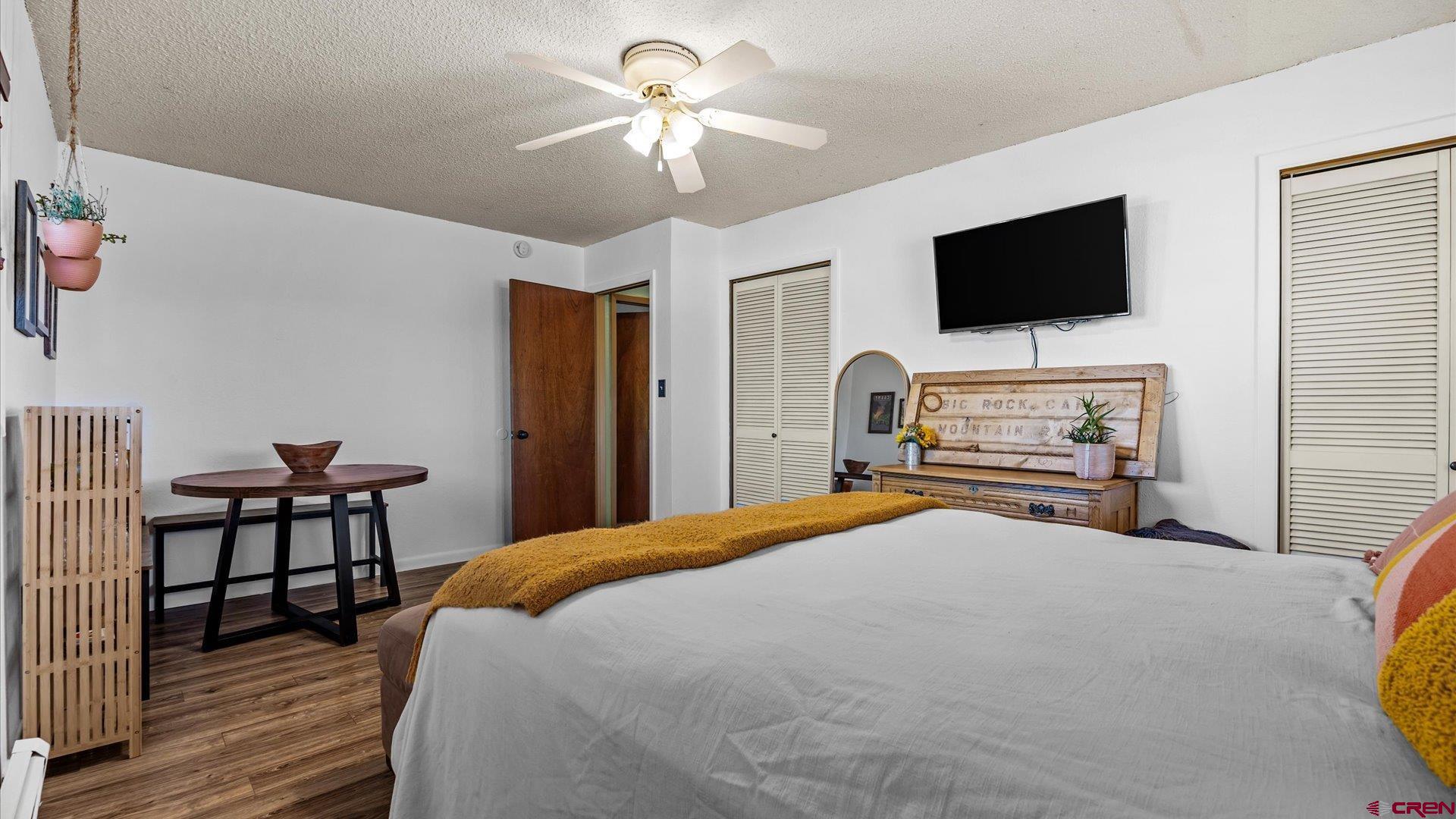 16205 6700th Road Montrose, CO 81401 - Photo 4 of 34 a bedroom with a bed and a flat screen tv