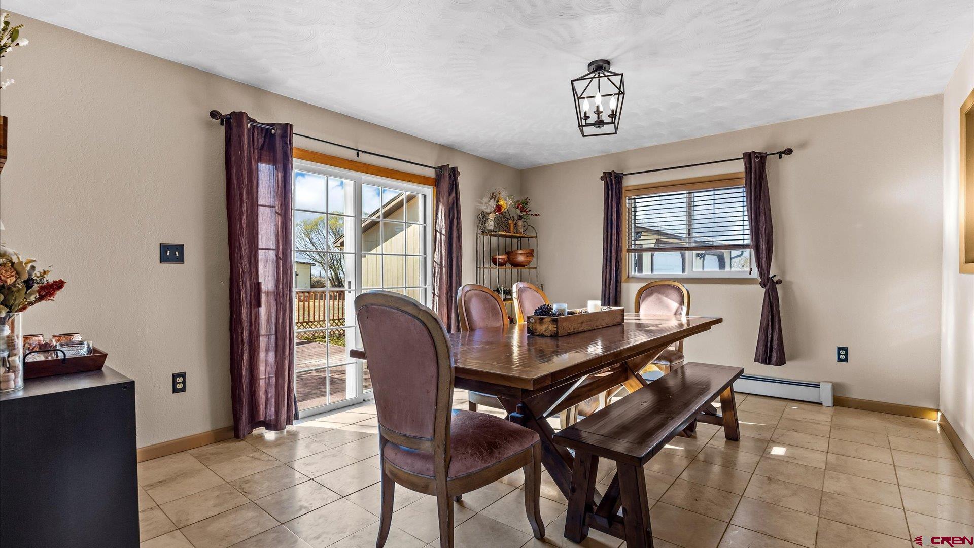 16205 6700th Road Montrose, CO 81401 - Photo 10 of 34 a view of a dining room with furniture window and outside view