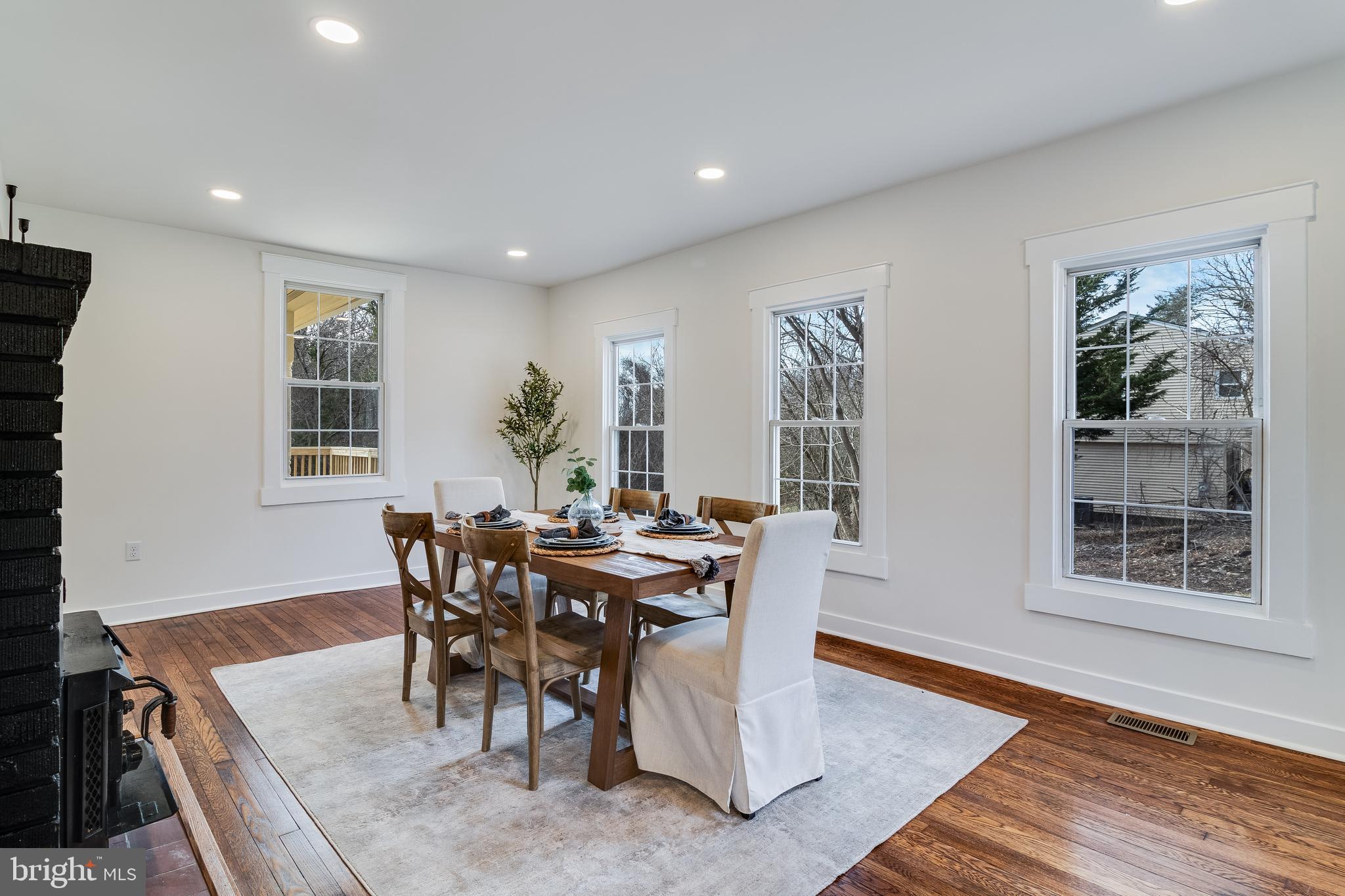 9316 Croom Road Upper Marlboro, MD 20772 - Photo 11 of 61 a view of a dining room with furniture and wooden floor