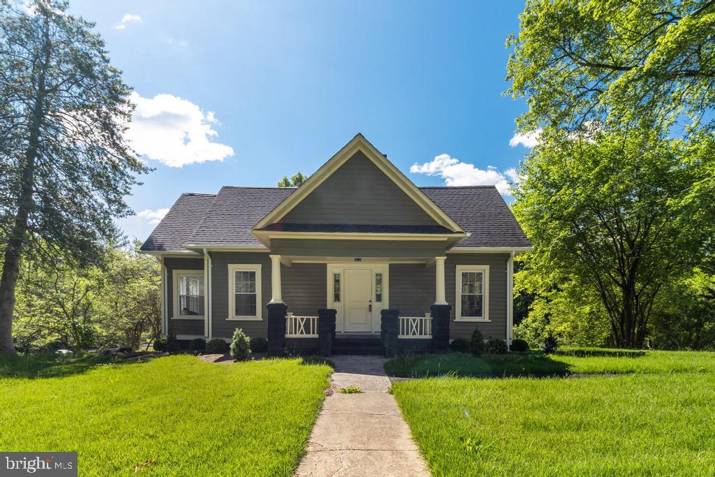 9316 Croom Road Upper Marlboro, MD 20772 - Photo 2 of 61 a front view of a house with yard and green space