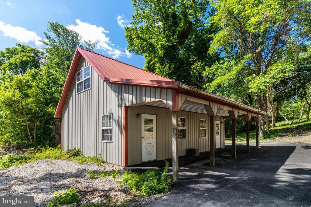 9316 Croom Road Upper Marlboro, MD 20772 - Photo 25 of 61 a front view of a house with garden