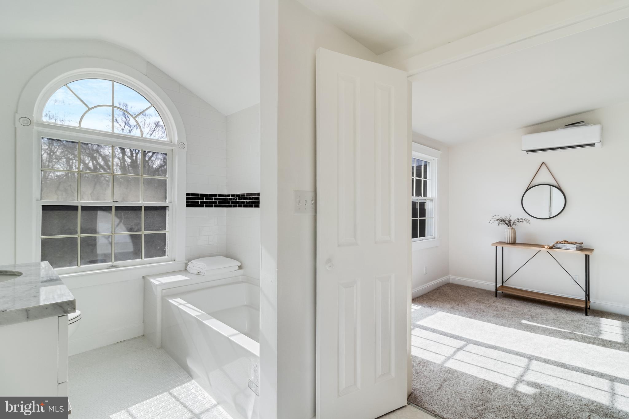 9316 Croom Road Upper Marlboro, MD 20772 - Photo 37 of 61 a spacious bathroom with a toilet a sink and bathtub