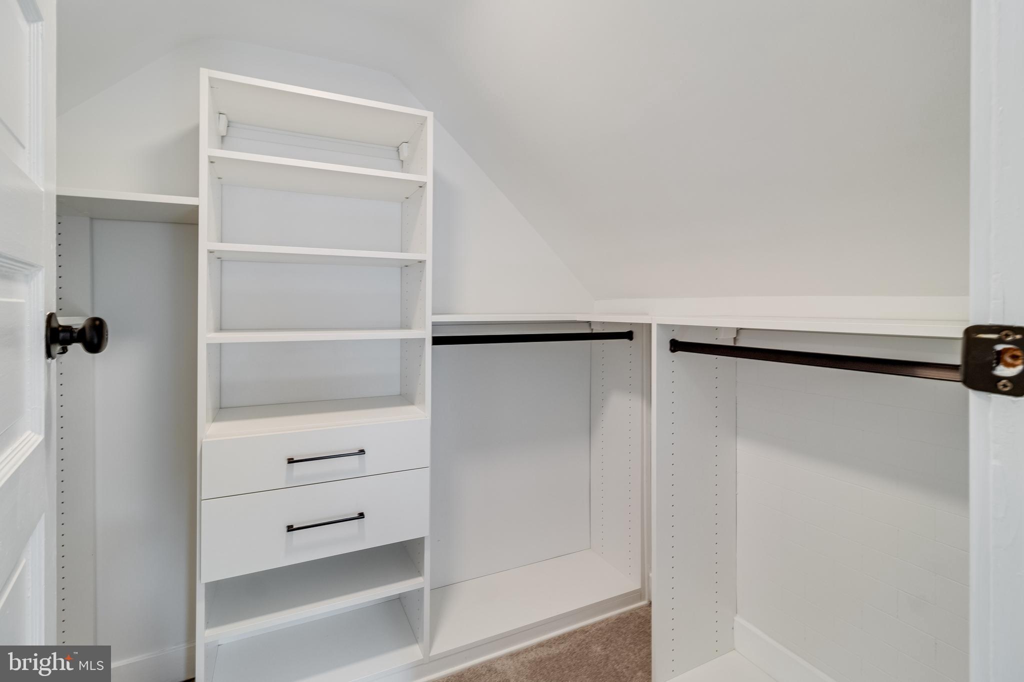 9316 Croom Road Upper Marlboro, MD 20772 - Photo 39 of 61 a view of walk in closet with empty racks