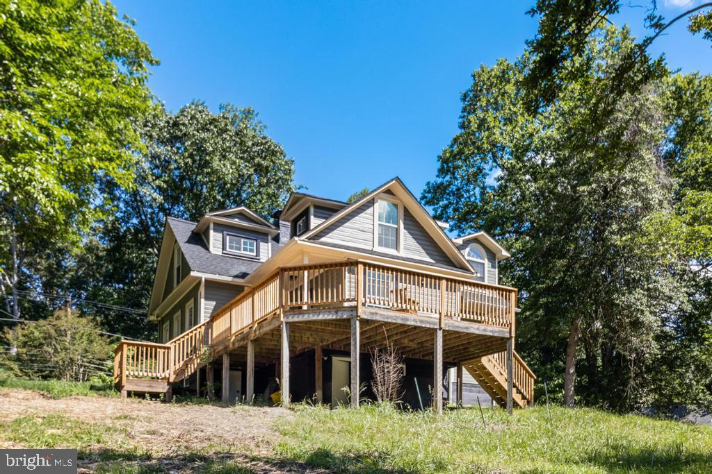 9316 Croom Road Upper Marlboro, MD 20772 - Photo 54 of 61 a front view of a house with yard and trees