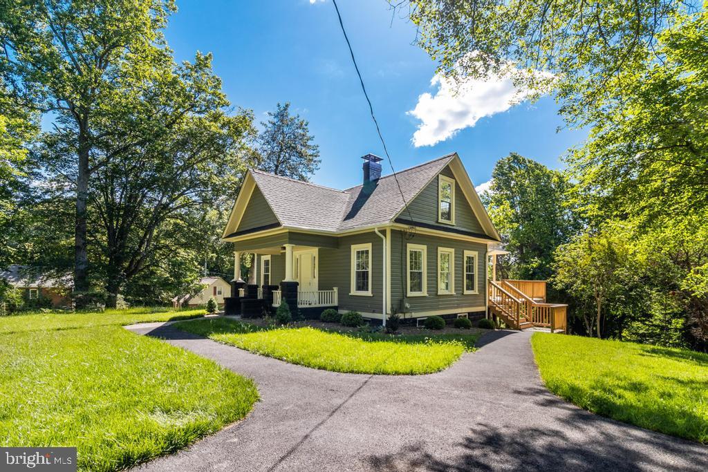 9316 Croom Road Upper Marlboro, MD 20772 - Photo 58 of 61 a view of a house with a swimming pool and a yard