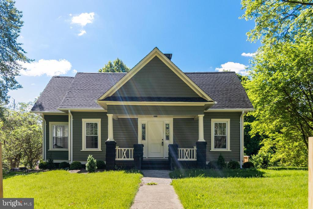 9316 Croom Road Upper Marlboro, MD 20772 - Photo 59 of 61 a front view of a house with a yard