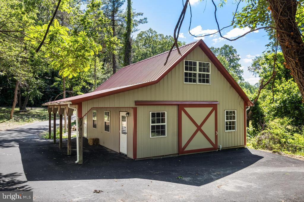 9316 Croom Road Upper Marlboro, MD 20772 - Photo 9 of 61 a front view of a house with garden