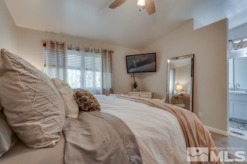 6023 Warm River Road Reno, NV 89523 - Photo 16 of 23 a bedroom with a bed and a tv