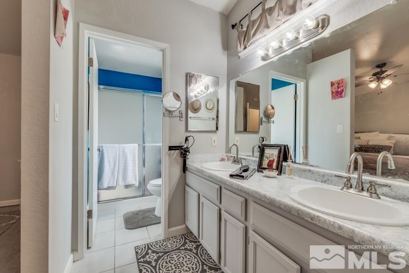 6023 Warm River Road Reno, NV 89523 - Photo 17 of 23 a bathroom with a sink and a mirror
