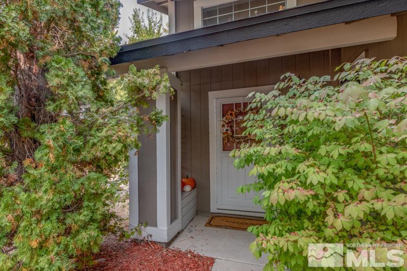 6023 Warm River Road Reno, NV 89523 - Photo 3 of 23 a couple of potted plants in front of door
