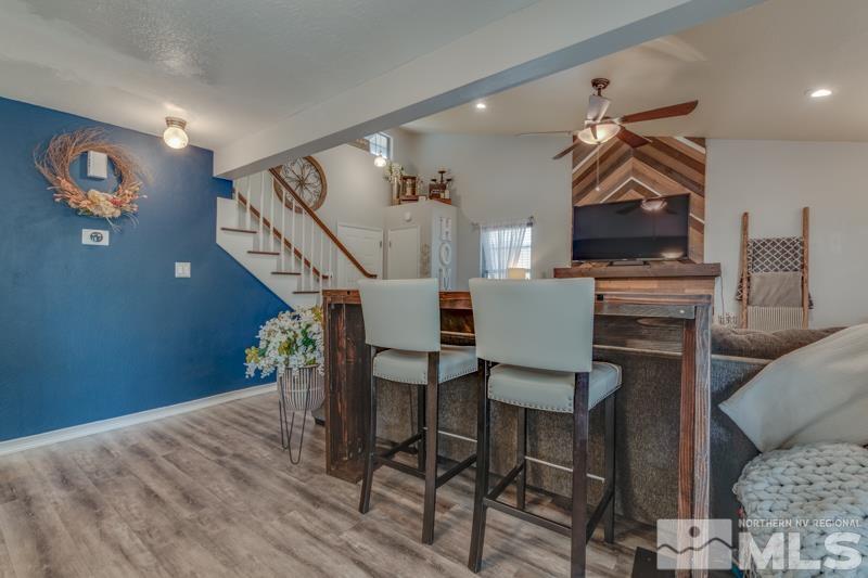6023 Warm River Road Reno, NV 89523 - Photo 8 of 23 a workspace with furniture and wooden floor