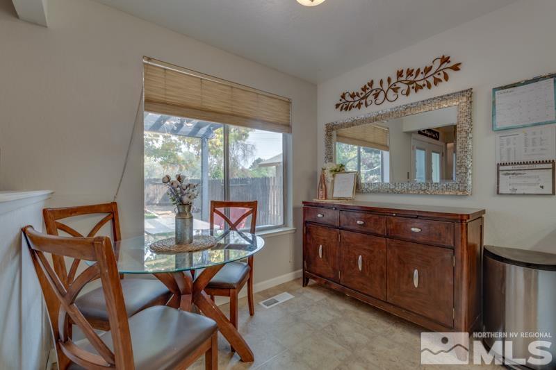 6023 Warm River Road Reno, NV 89523 - Photo 9 of 23 a living room with furniture and a window