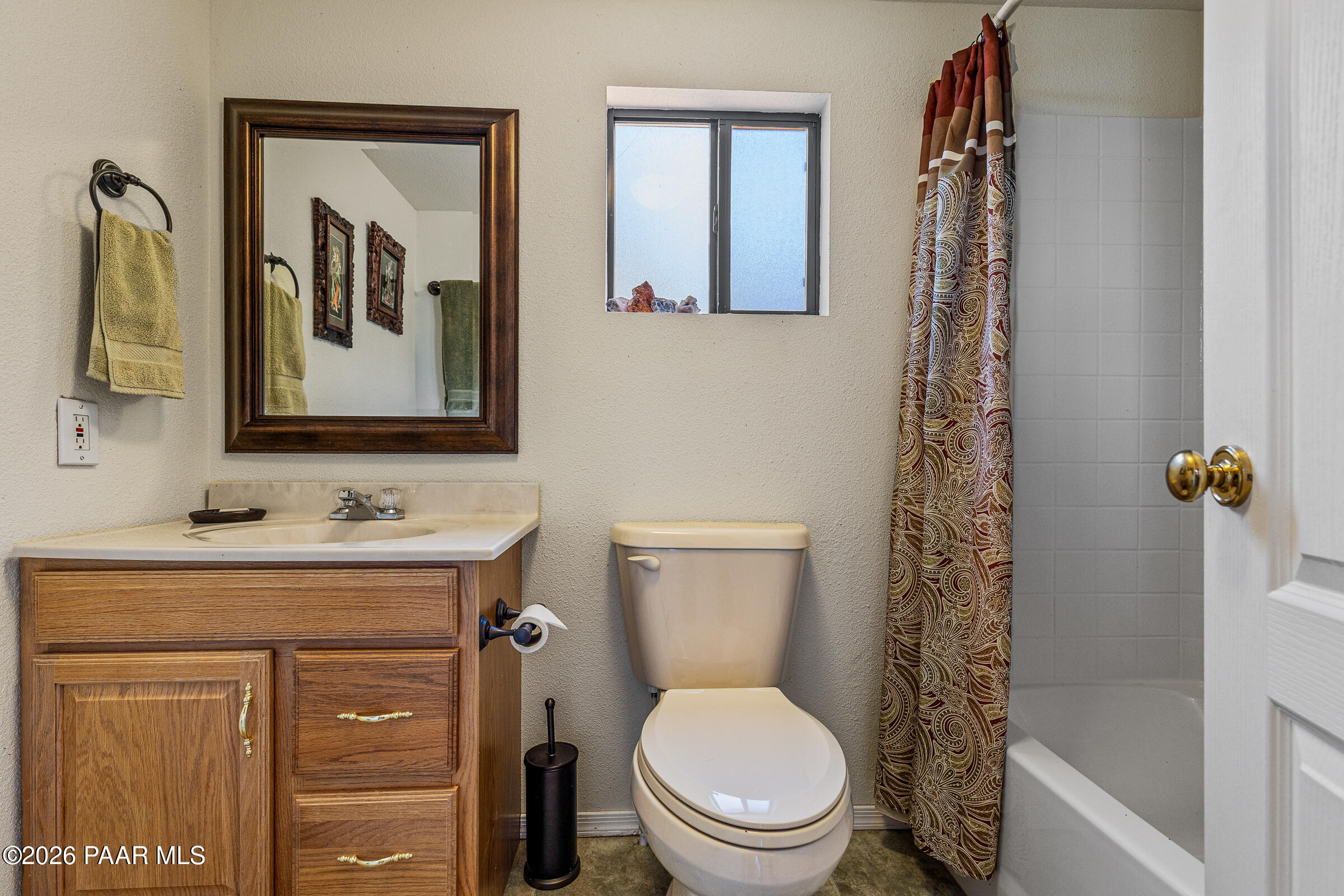 33749 West Whiskey River Road, Unit 21 Seligman, AZ 86337 - Photo 20 of 41 a bathroom with a toilet sink and mirror