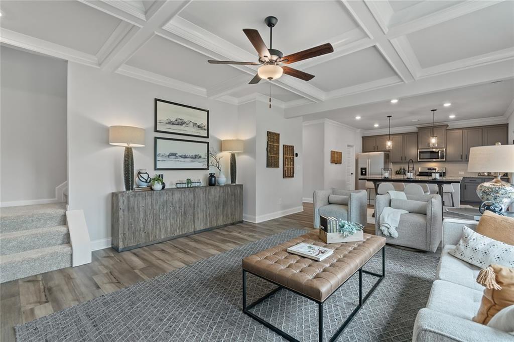 73 Cardinal Pond Lane Winder, GA 30680 - Photo 12 of 59 a living room with furniture and a wooden floor