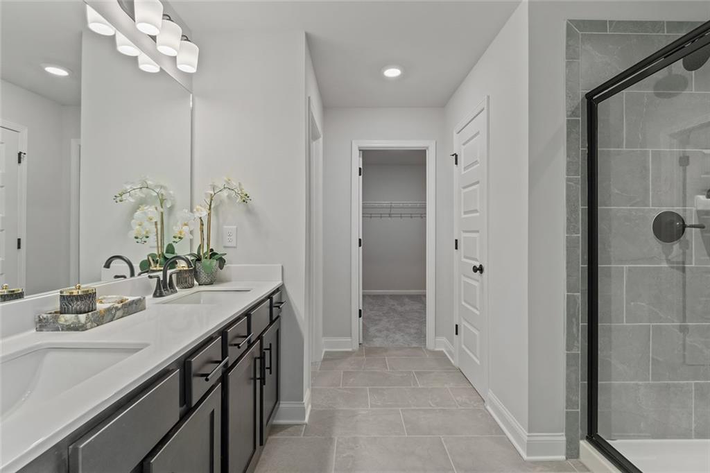 73 Cardinal Pond Lane Winder, GA 30680 - Photo 21 of 59 a bathroom with a double vanity sink mirror and shower