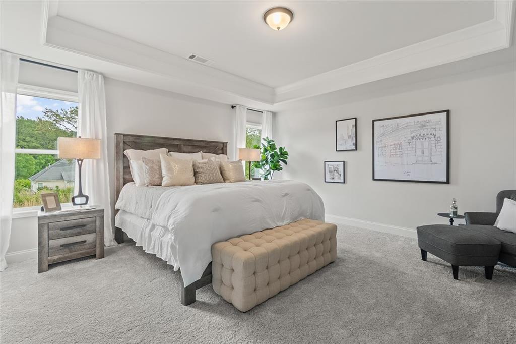 73 Cardinal Pond Lane Winder, GA 30680 - Photo 24 of 59 a bed room with a bed and a chair