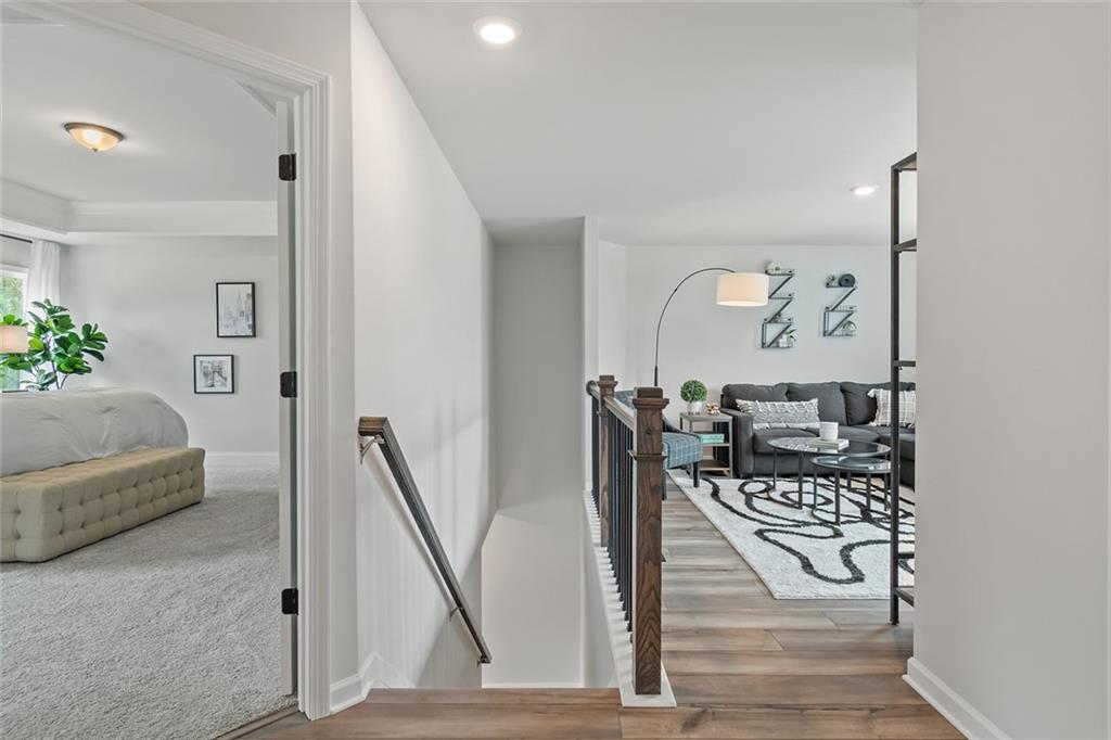 73 Cardinal Pond Lane Winder, GA 30680 - Photo 27 of 59 a living room with furniture and a painting on the wall