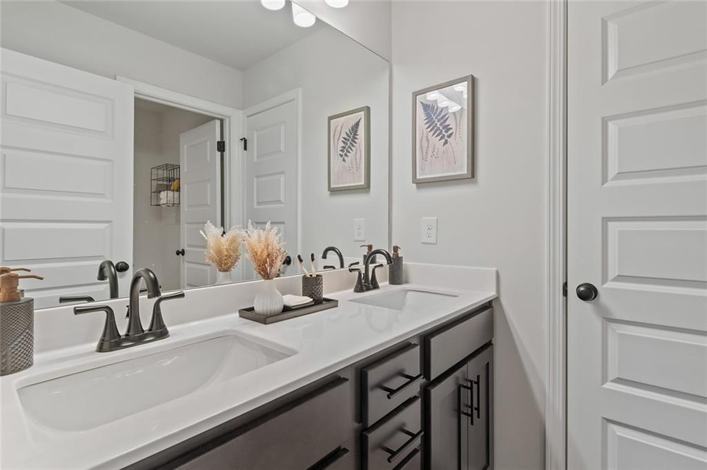 73 Cardinal Pond Lane Winder, GA 30680 - Photo 3 of 59 a bathroom with a sink and a mirror