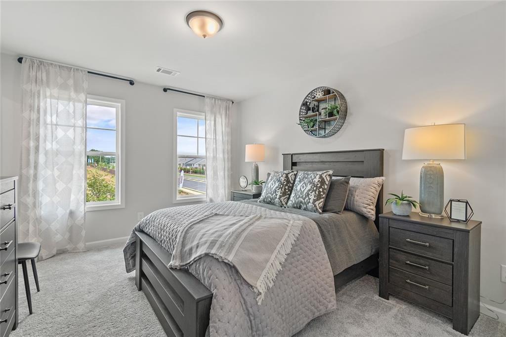 73 Cardinal Pond Lane Winder, GA 30680 - Photo 5 of 59 a bedroom with a bed and a window