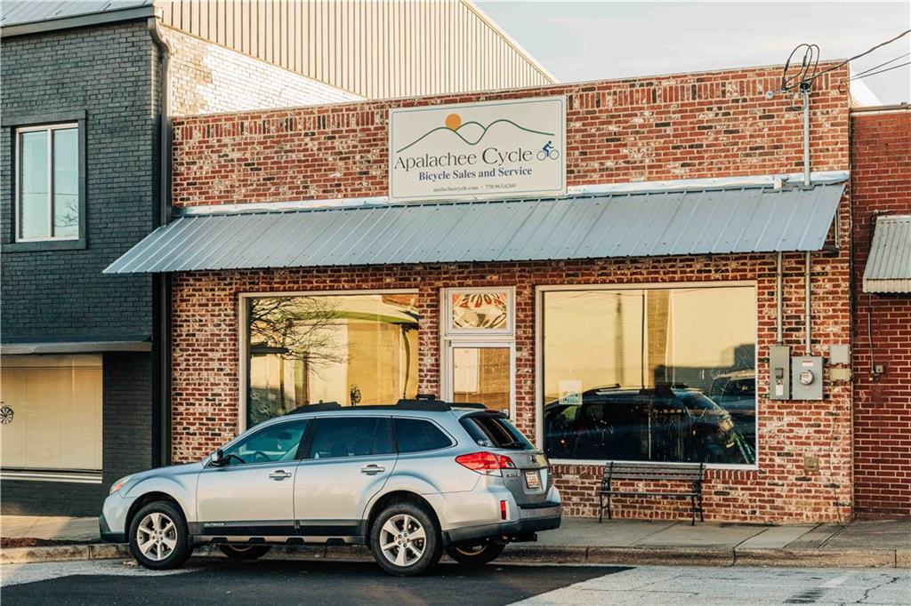 73 Cardinal Pond Lane Winder, GA 30680 - Photo 53 of 59 a blue car parked in front of a building
