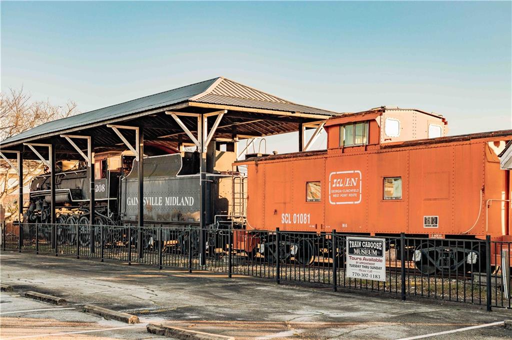 73 Cardinal Pond Lane Winder, GA 30680 - Photo 58 of 59 a front view of a building with retail shops
