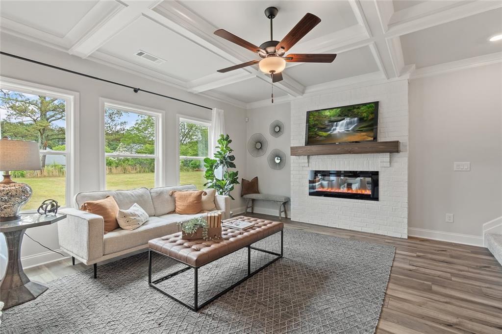 73 Cardinal Pond Lane Winder, GA 30680 - Photo 10 of 59 a living room with furniture a flat screen tv and a fireplace