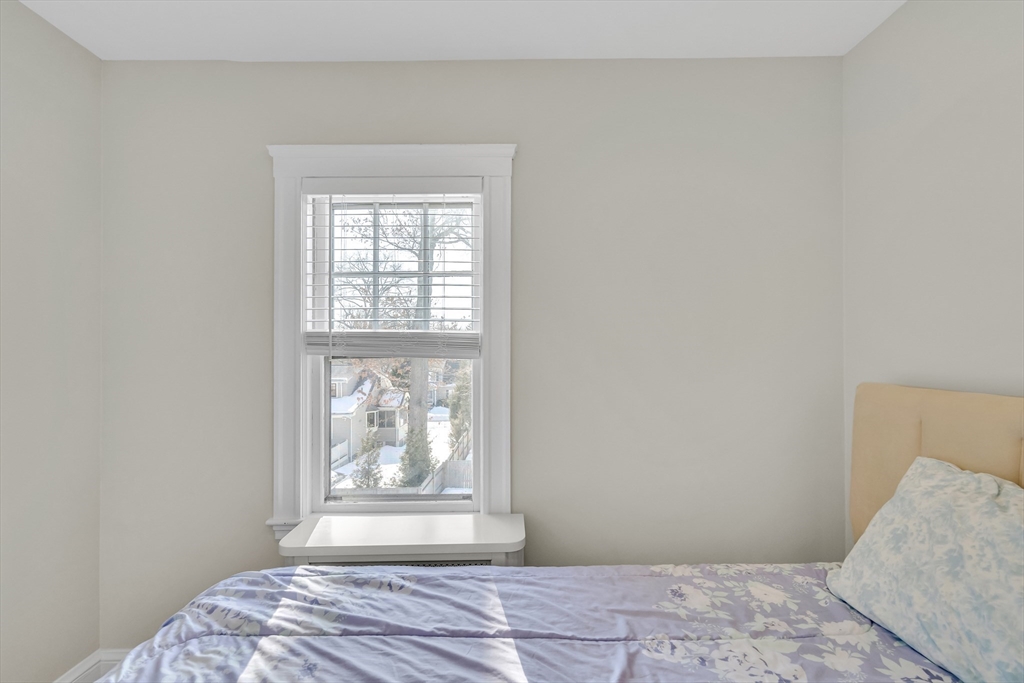 10 Dexter Road Lexington, MA 02420 - Photo 23 of 35 a bedroom with a bed and a window