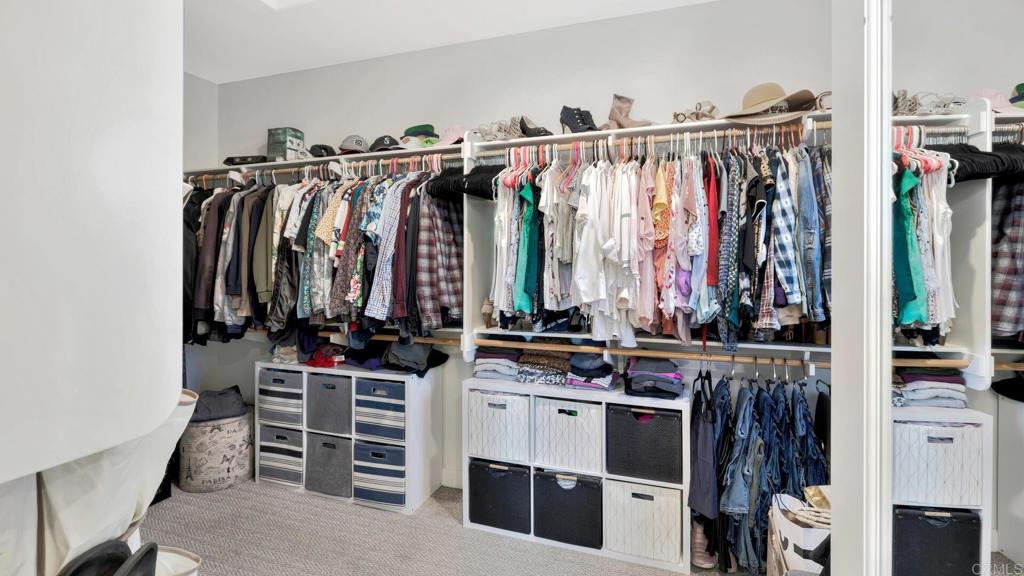 2904 Starry Night Drive Escondido, CA 92029 - Photo 18 of 54 a view of walk in closet with clothes and shoes
