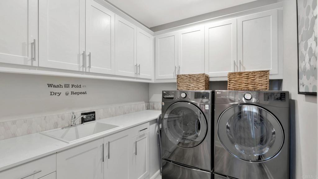 2904 Starry Night Drive Escondido, CA 92029 - Photo 20 of 54 a utility room with sink dryer and washer