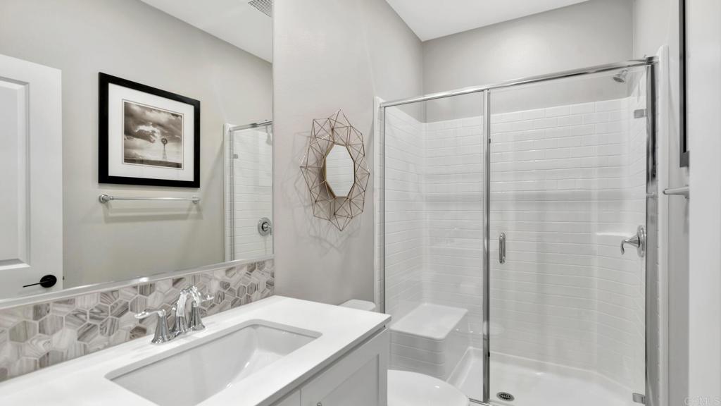 2904 Starry Night Drive Escondido, CA 92029 - Photo 29 of 54 a bathroom with a sink and a mirror