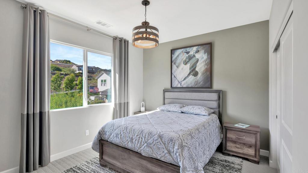 2904 Starry Night Drive Escondido, CA 92029 - Photo 30 of 54 a bedroom with a large bed and a window