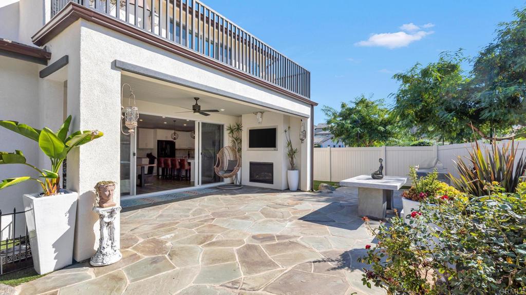 2904 Starry Night Drive Escondido, CA 92029 - Photo 35 of 54 a view of a patio with table and chairs and potted plants