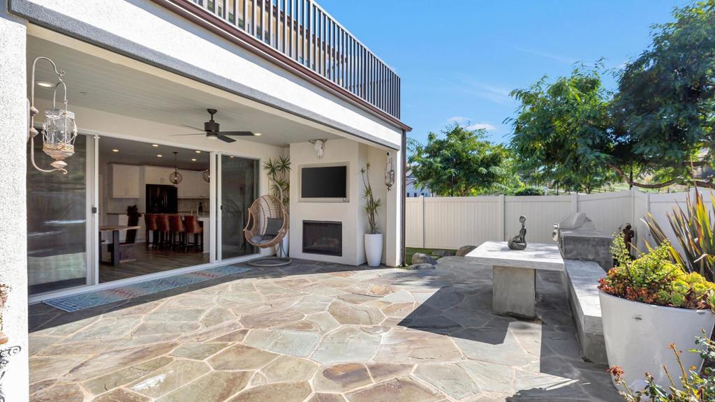 2904 Starry Night Drive Escondido, CA 92029 - Photo 39 of 54 a view of a patio with table and chairs and potted plants
