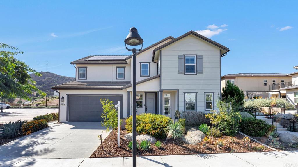 2904 Starry Night Drive Escondido, CA 92029 - Photo 40 of 54 a front view of a house with garden
