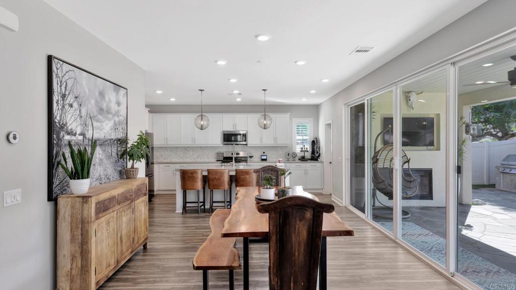 2904 Starry Night Drive Escondido, CA 92029 - Photo 4 of 54 a living room with stainless steel appliances kitchen island granite countertop furniture and a rug