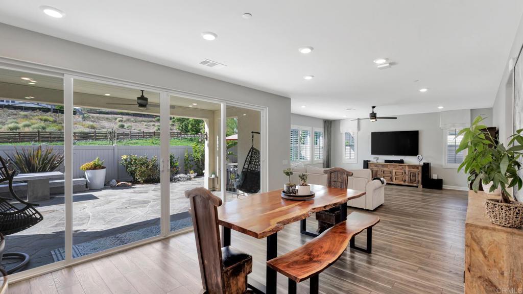 2904 Starry Night Drive Escondido, CA 92029 - Photo 6 of 54 a living room with furniture a flat screen tv and a large window