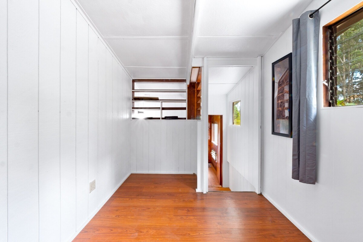 16-2006 Uhini Ana Road Mountain View, HI 96771 - Photo 23 of 25 a view of a hallway with wooden floor and closet
