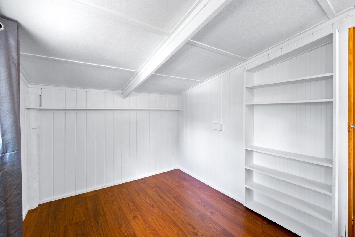 16-2006 Uhini Ana Road Mountain View, HI 96771 - Photo 24 of 25 a view of an empty room with wooden floor