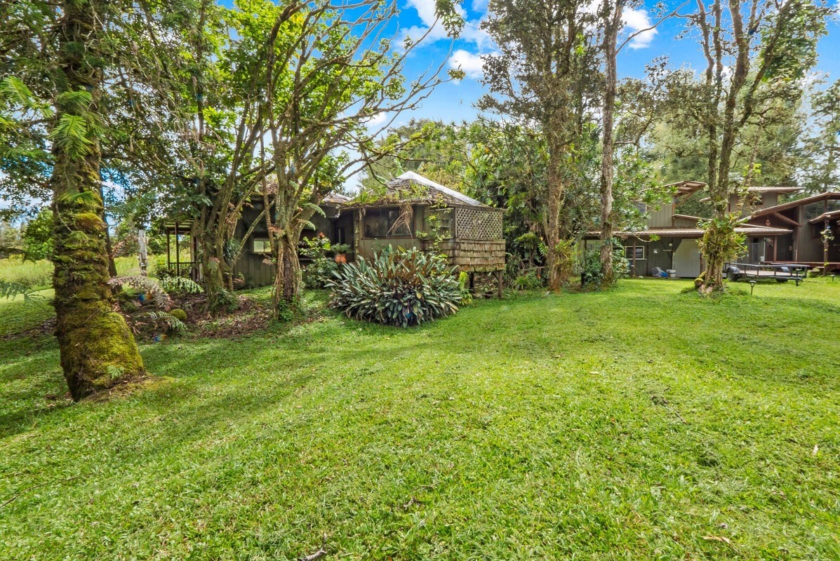 16-2006 Uhini Ana Road Mountain View, HI 96771 - Photo 7 of 25 a view of a garden with a building