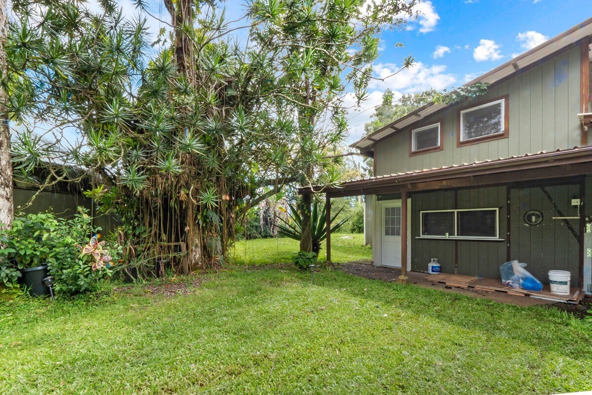 16-2006 Uhini Ana Road Mountain View, HI 96771 - Photo 9 of 25 a view of a backyard with a large tree